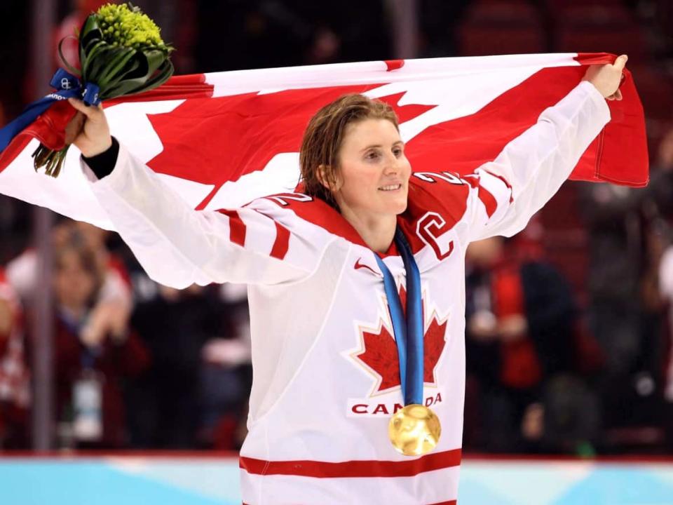 Hayley Wickenheiser, of Shaunavon, Sask., is seen celebrating Canada's 2010 Olympic women's hockey gold medal in Vancouver. (Jonathan Hayward/The Canadian Press - image credit)