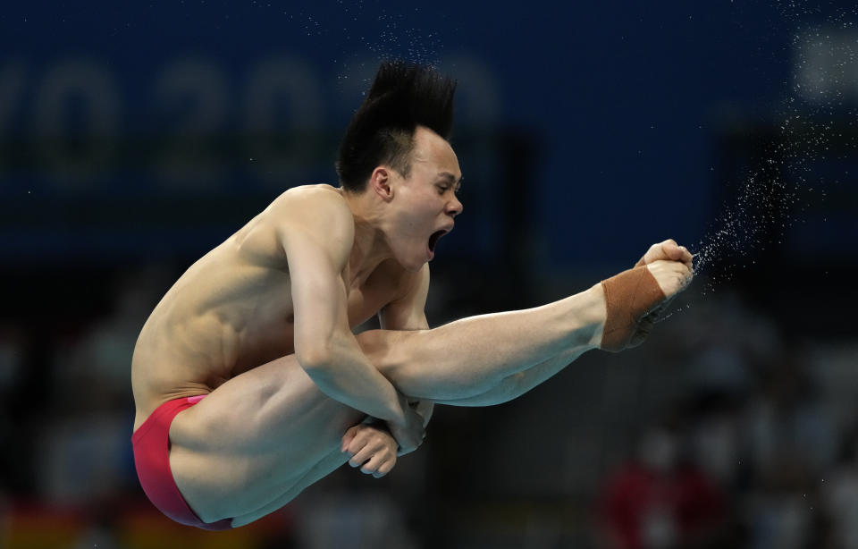 Xie Siyi of China competes in men's diving 3m springboard final at the Tokyo Aquatics Centre at the 2020 Summer Olympics, Tuesday, Aug. 3, 2021, in Tokyo, Japan. (AP Photo/Dmitri Lovetsky)