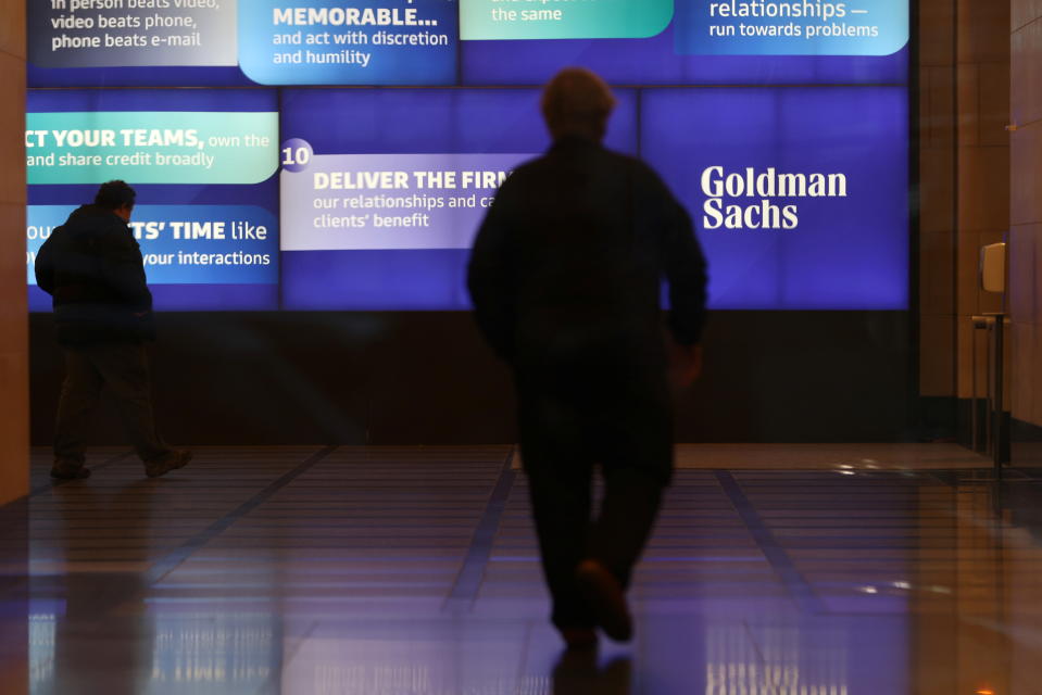 People walk in the Goldman Sachs global headquarters in Manhattan, New York, U.S., November 15, 2021. REUTERS/Andrew Kelly