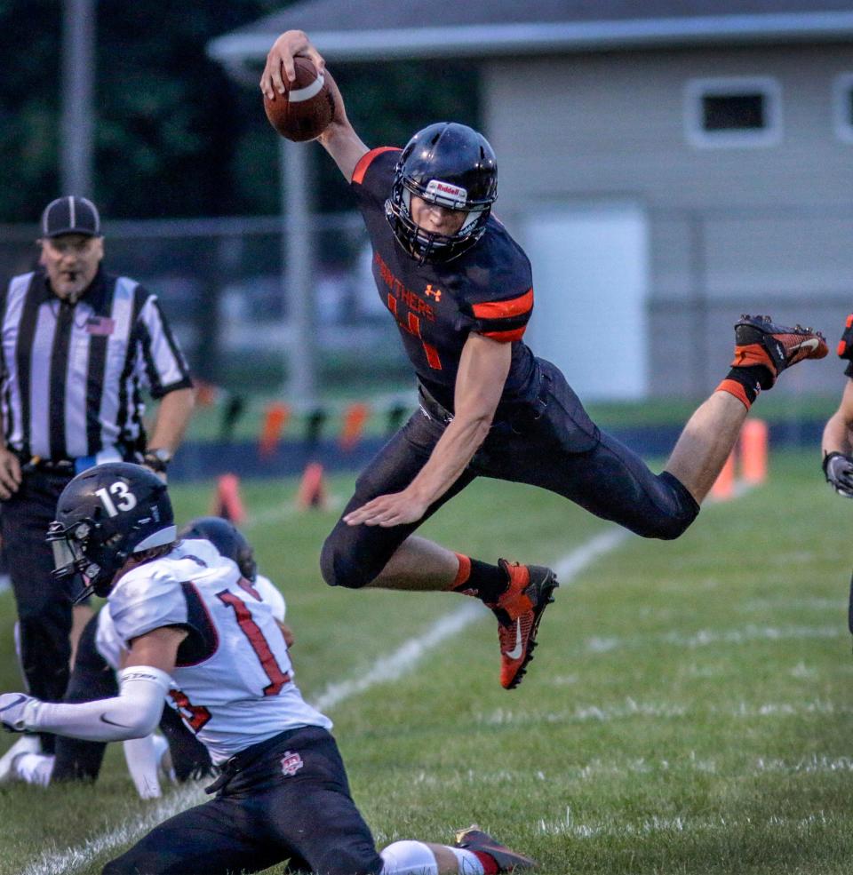 Reedsville's Brennen Dvorachek (4) is high flying against Lourdes Academy, Friday, August 27, 2021, in Reedsville, Wis.