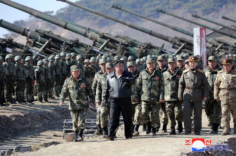 North Korean leader Kim Jong Un guides an artillery firing drill by the Korean People's Army