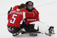 <div>PURE EMOTION - Vasilii Varlakov celebrates with Vladimir Kamantcev after winning the Ice Sledge Hockey semi-final match between Russia and Norway at the Shayba Arena.</div>