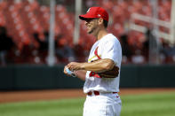 St. Louis Cardinals starting pitcher Adam Wainwright (50) smiles as he prepares to put on his protective face mask after pitching nine complete innings against the Cleveland Indians, Sunday, Aug. 30, 2020, in St. Louis. (AP Photo/Scott Kane)