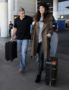 <p>Clooney capped things off with a black hat and shoulder bag. <i>(Photo via Splash News)</i></p>