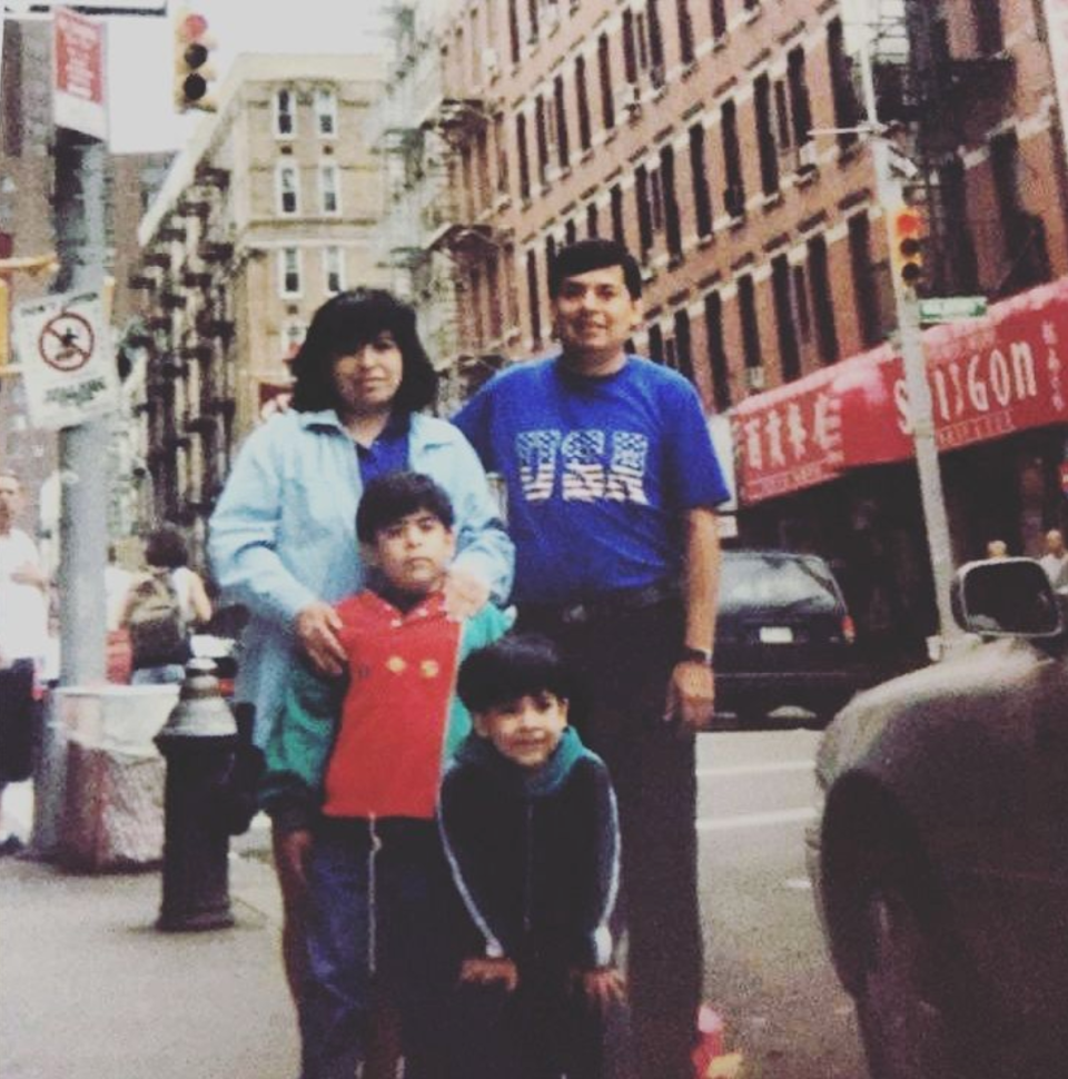 Robert W. Fernandez, in red, with his parents, Rosa and William, and brother Diego in New York City in 1996, four years after arriving from Peru.