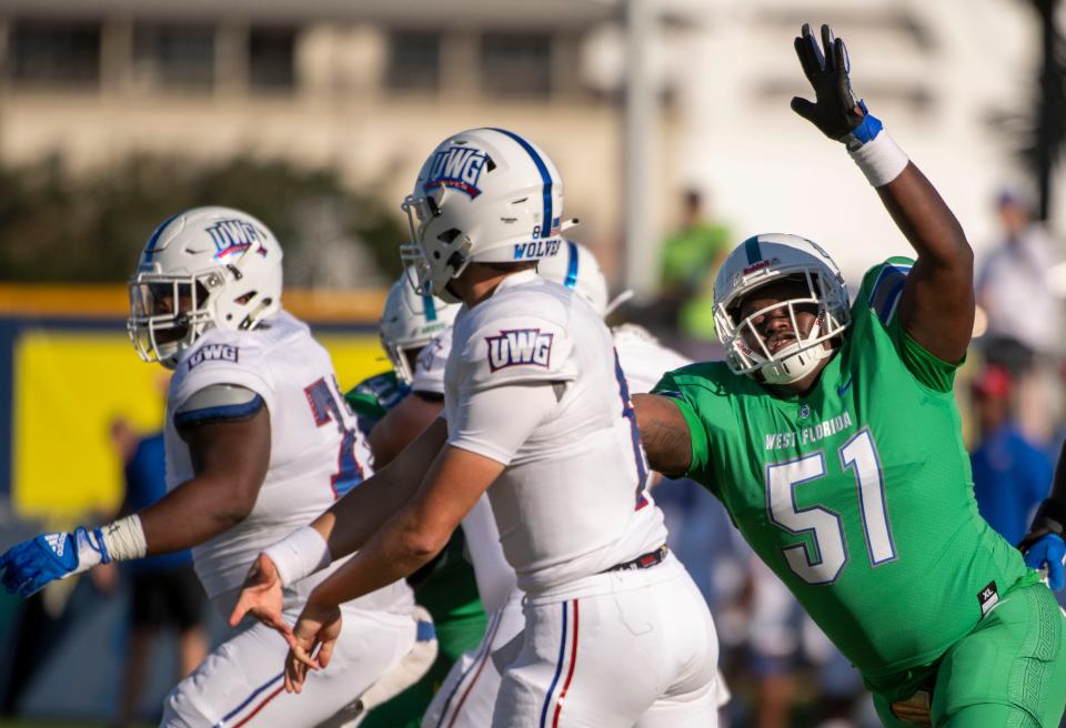 West Florida's Brandon Penerton (51) goes after West Georgia's quarter back Harrison Frost Saturday, October 16, 2021 during the West Florida West Georgia game at Blue Wahoos Stadium.