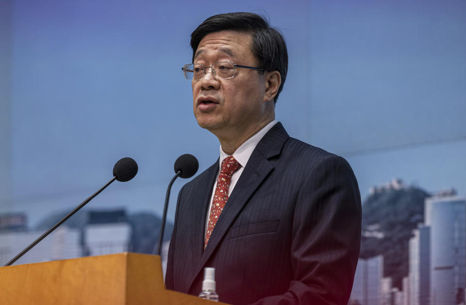 FILE - Hong Kong Chief Executive John Lee speaks during a news conference in Hong Kong, March 21, 2023. Hong Kong’s leader on Tuesday, May 16, 2023 said Beijing’s sentencing on spying charges of a U.S. citizen who was also a permanent resident of the semi-autonomous Chinese city was justification for a years-long crackdown on activities deemed subversive. (AP Photo/Louise Delmotte, File)