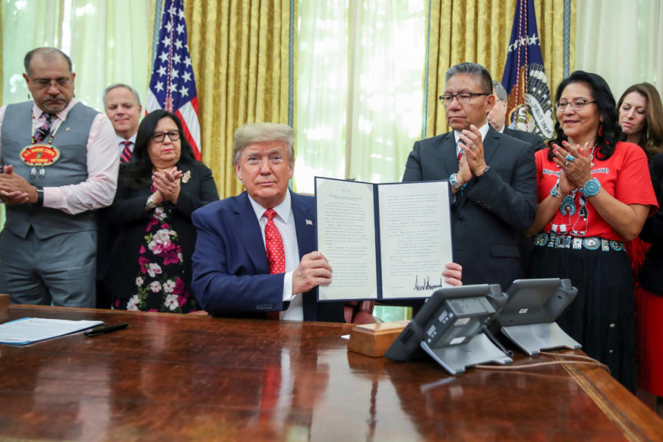 <div class="inline-image__caption"><p>Then U.S. President Donald Trump displays an Executive Order establishing the Task Force on Missing and Murdered American Indians and Alaska Natives on November 26, 2019. </p></div> <div class="inline-image__credit">REUTERS</div>