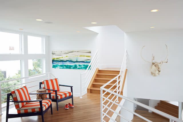 A white stairway with a pop of color