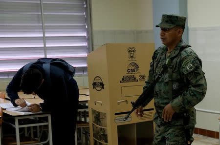 A soldier patrols during Ecuador's presidential election at a polling station in Quito, Ecuador, February 19, 2017. REUTERS/Mariana Bazo