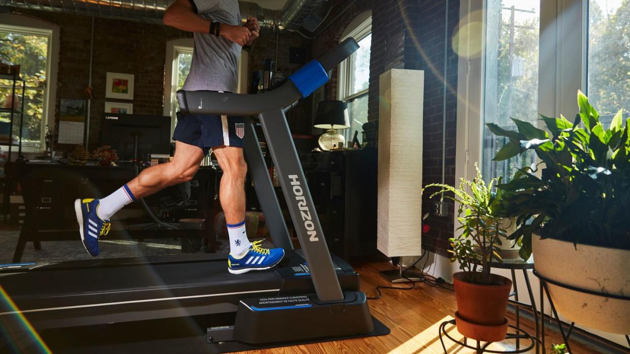 running in living room on horizon folding treadmill