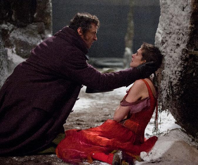 This film image released by Universal Pictures shows Hugh Jackman as Jean Valjean, left, and Anne Hathaway as Fantine in a scene from "Les Miserables." (AP Photo/Universal Pictures, Laurie Sparham)