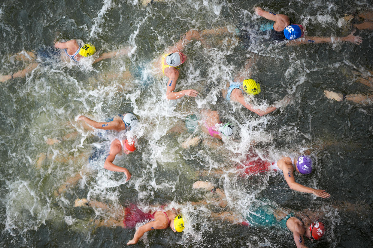 Australia's Natalie Van Coevorden, center, competes in the swim leg of the women's individual triathlon competition at the 2024 Summer Olympics on July 31, 2024, in Paris, France. (David Goldman/AP)