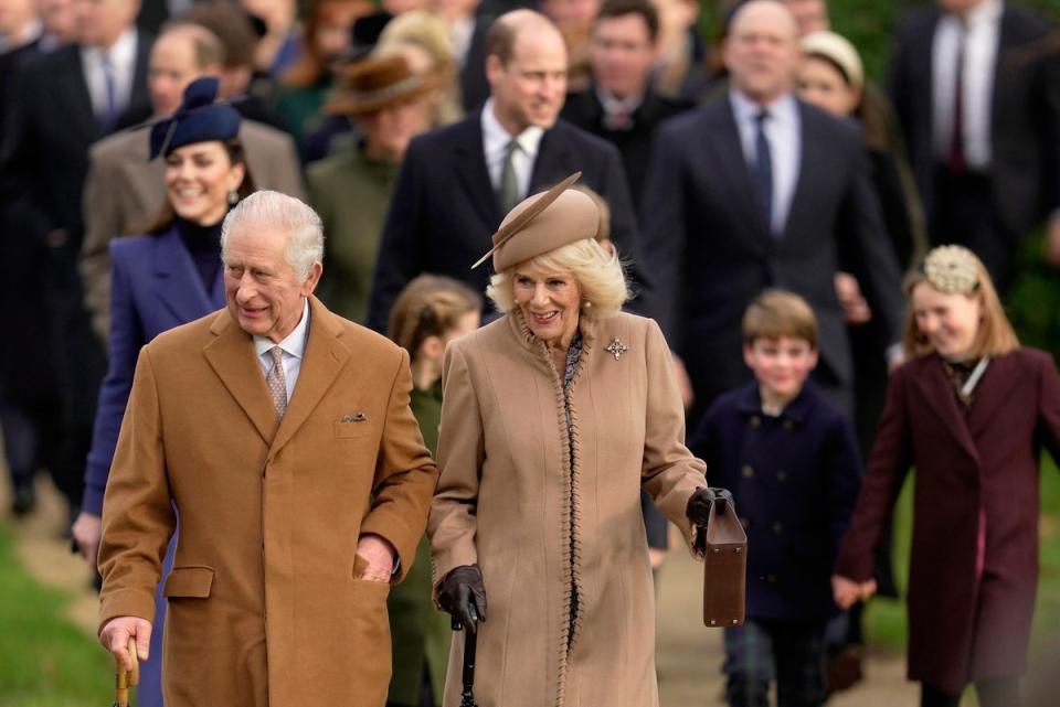 File photo: King Charles III, pictured here with Queen Camilla attending a Christmas day service in Norfolk, will attend hospital next week (AP)