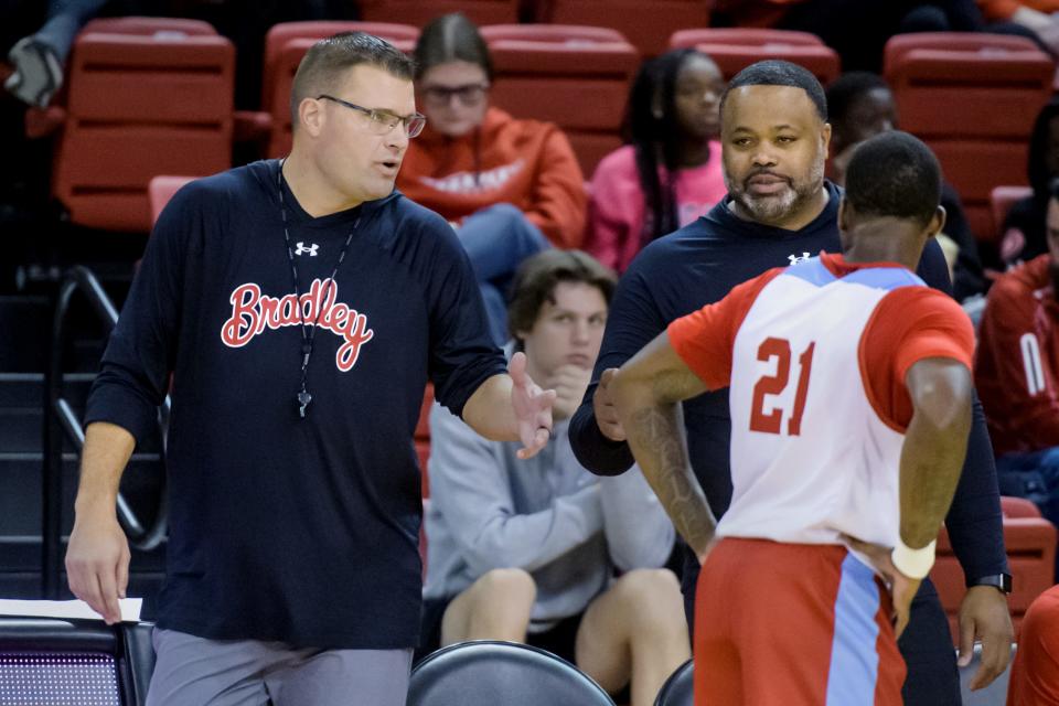 Bradley head coach Brian Wardle, left, and associate head coach Jimmie Foster talk with point guard Duke Deen during the Red-White Scrimmage on Saturday, Oct. 21, 2023 at Renaissance Coliseum.