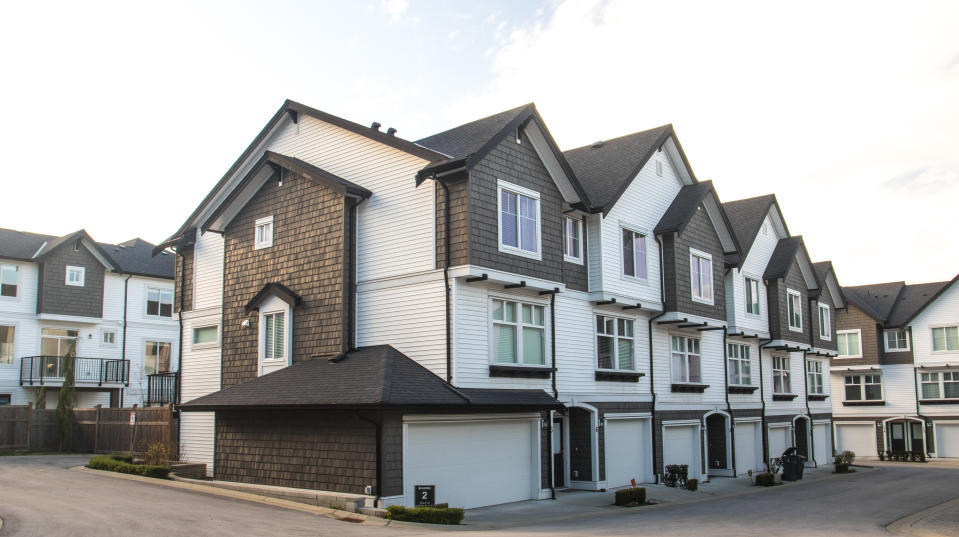 Canada real estate: Great and comfortable neighborhood. A row of townhouses at the empty street.
