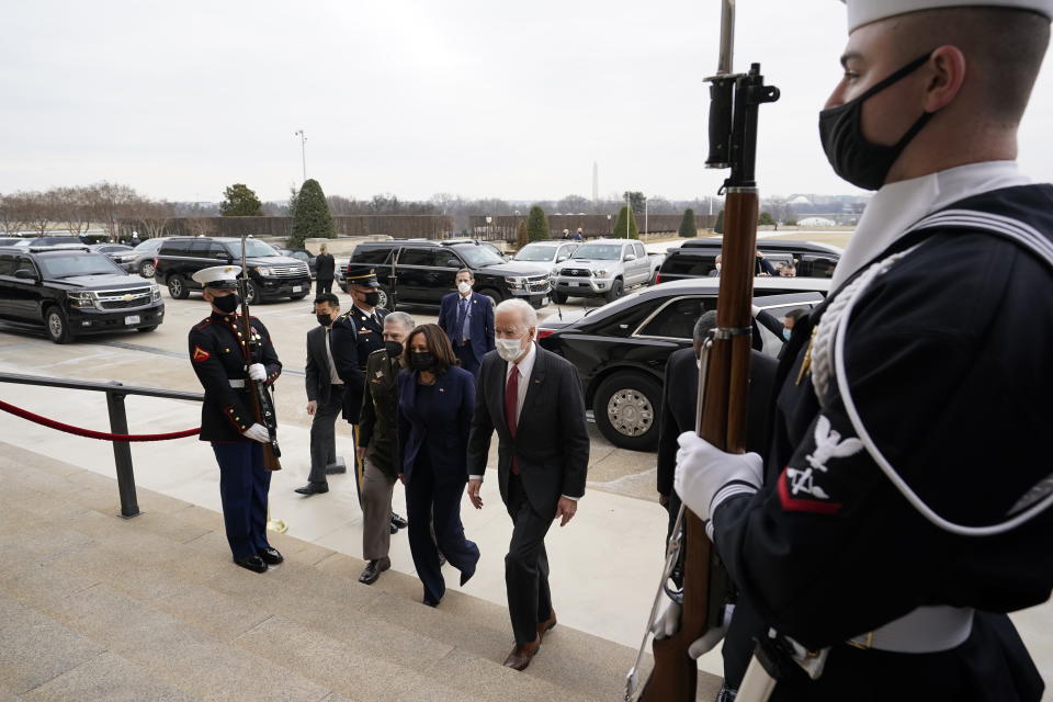 President Joe Biden and Vice President Kamala Harris walk with Joint Chiefs Chairman Gen. Mark Milley and Secretary of Defense Lloyd Austin, obscured at right, at the Pentagon, Wednesday, Feb. 10, 2021, in Washington. (AP Photo/Alex Brandon, Pool)