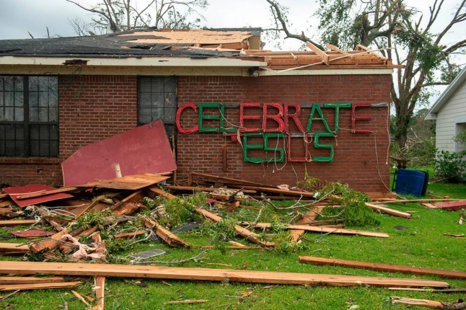 Part of a sign remains on a damaged home in Moss Point on Tuesday, June 20, 2023, after a tornado tore through the town on Monday.