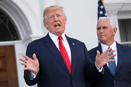 U.S. President Donald Trump speaks to reporters with Vice President Mike Pence at his side at Trump's golf estate in Bedminster, New Jersey U.S. August 10, 2017. REUTERS/Jonathan Ernst