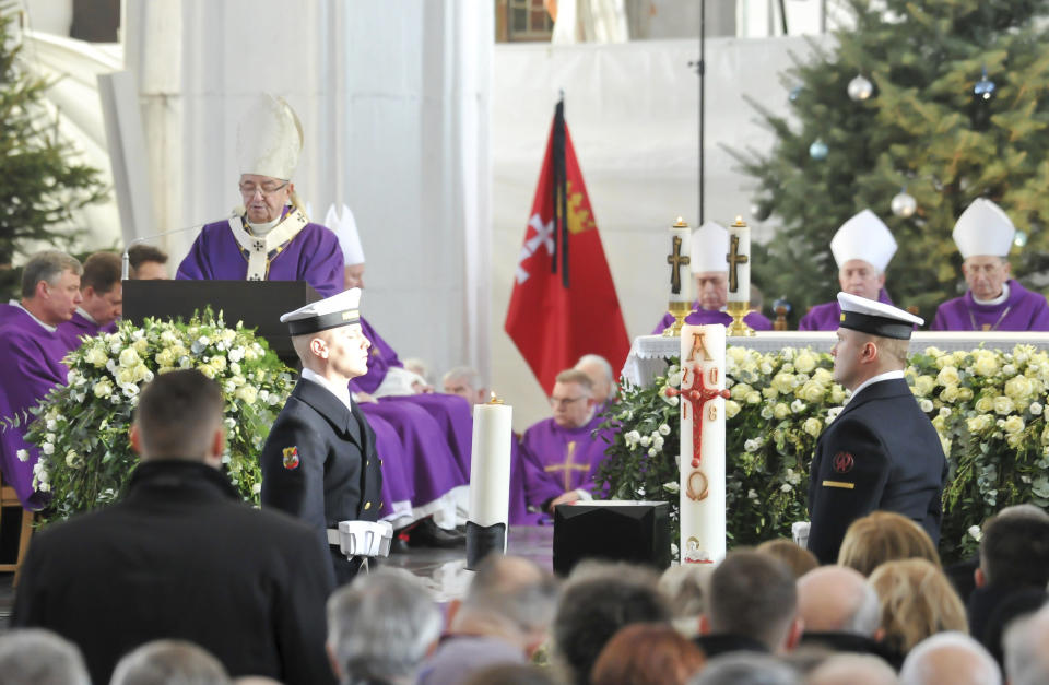 Gdansk Archbishop Slawoj Leszek Glodz appeals for unity among Poland's divided politicians during the funeral of slain Gdansk city Mayor Pawel Adamowicz that was attended by Poland's leaders at St. Mary's Basilica in Gdansk, Poland, on Saturday, Jan. 19, 2019. Adamowicz died Monday after being stabbed the night before at a charity event by an ex-convict with a grudge against an opposition party that Adamowicz once belonged to.(AP Photo/Wojtek Strozyk)