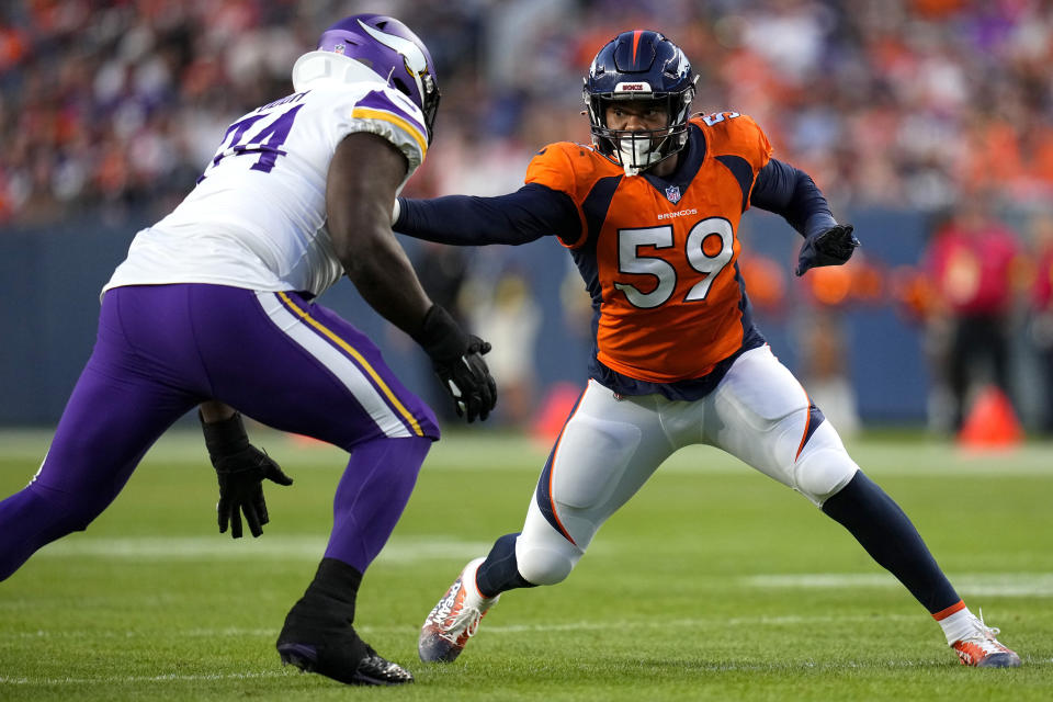 Denver Broncos linebacker Malik Reed (59) battles Minnesota Vikings defensive tackle Dalvin Tomlinson during the first half of an NFL preseason football game, Saturday, Aug. 27, 2022, in Denver. (AP Photo/Jack Dempsey)