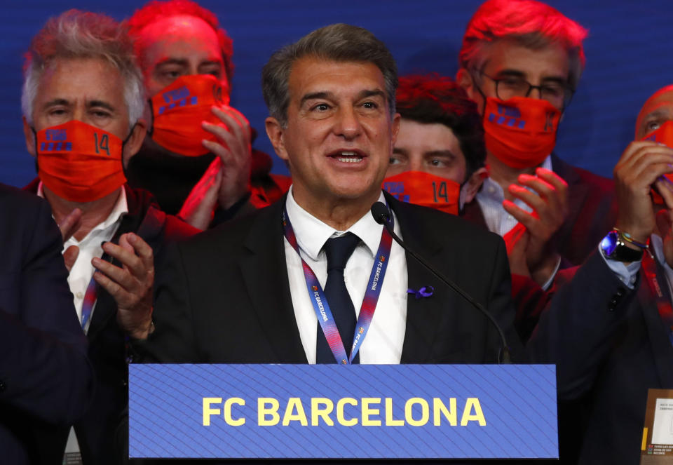 Joan Laporta celebrates his victory after elections at the Camp Nou stadium in Barcelona, Spain, Sunday, March 7, 2021. Joan Laporta has been elected Barcelona's president on Sunday, inheriting a club mired in debt and facing daunting problems that include the possible departure of Messi when his contract ends at the end of the season. (AP Photo/Joan Monfort)