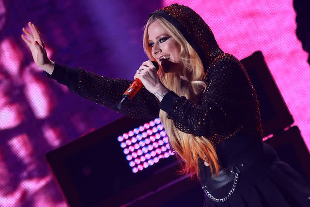 <p>Toni Anne Barson/FilmMagic</p> Avril Lavigne performs at the iHeartRadio Music Festival at T-Mobile Arena in September 2022 in Las Vegas