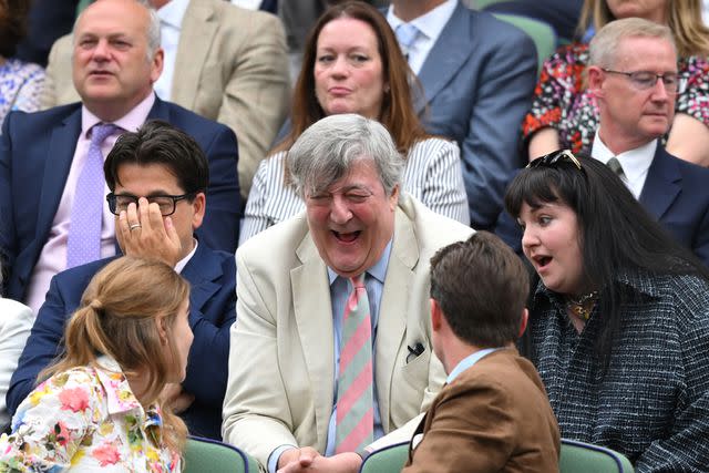 <p>Karwai Tang/WireImage</p> (Back row from left) Michael McIntyre, Stephen Fry and Lena Dunham chat with (front row from left) Princess Beatrice and Edoardo Mapelli Mozzi at Wimbledon on July 9, 2024