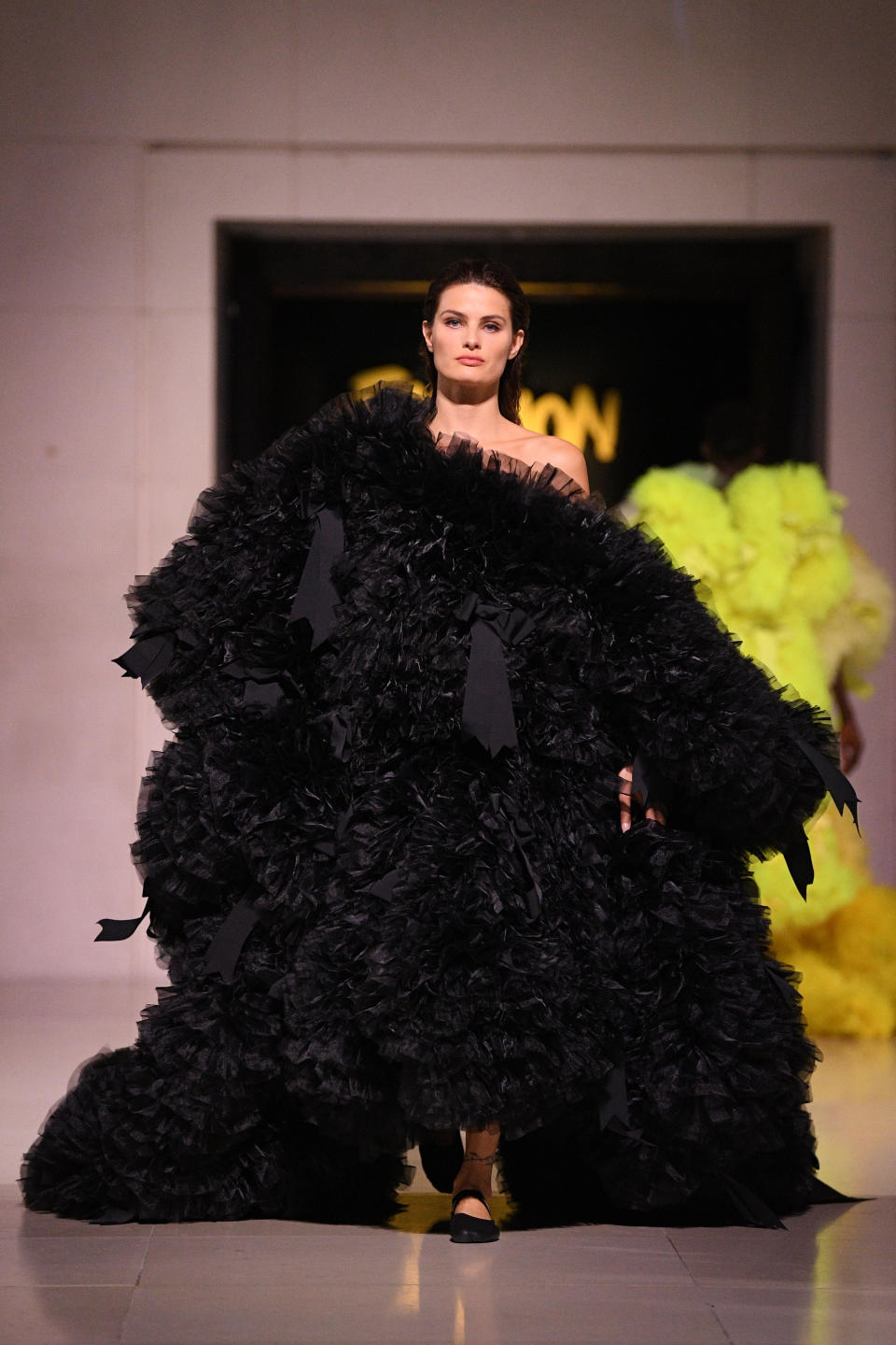 Isabeli Fontana walks the runway at the Spring Summer 2020 Fashion For Relief show during London Fashion Week [Photo: Getty Images]