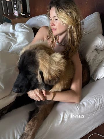 <p>Adam Levine/Instagram</p> Behati Prinsloo poses with her and husband Adam Levine's dog.