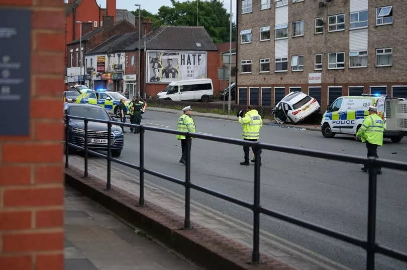 Officers at the scene of the crash on Bury New Road