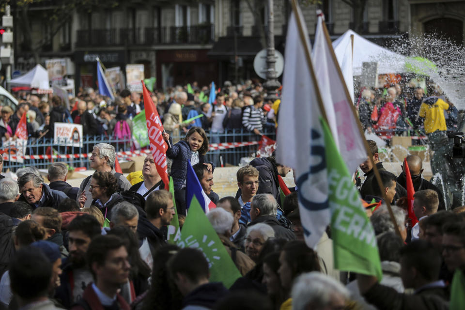 Conservative activists gather to protest in Paris, Sunday Oct. 6, 2019, against a French bill that would give lesbian couples and single women access to in vitro fertilization and related procedures. Traditional Catholic groups and far-right activists organized Sunday's protest, arguing that it deprives children of the right to a father. (AP Photo/Rafael Yaghobzadeh)