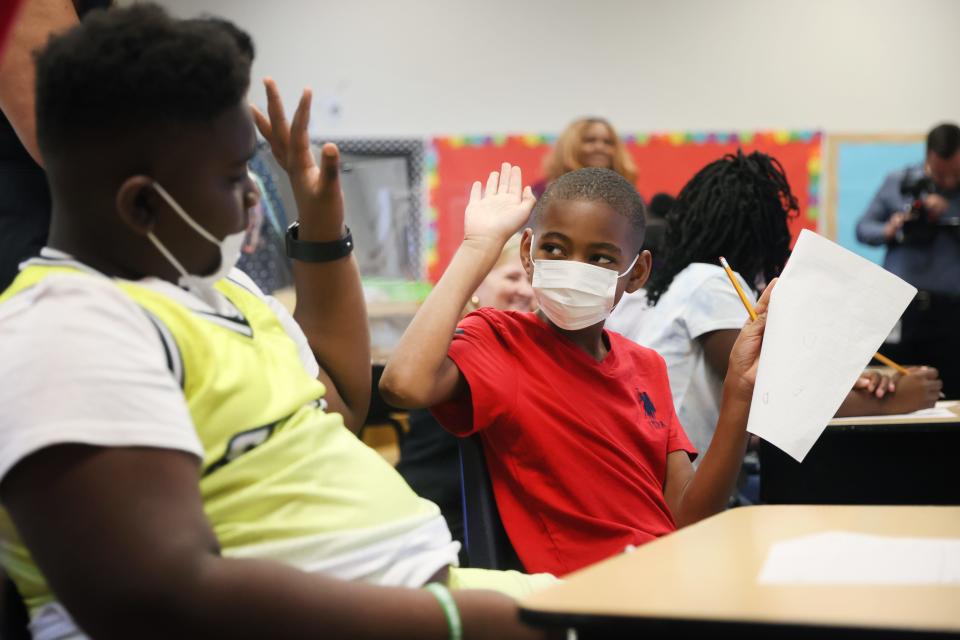 Elijah Branch, 11, right, high-fives Mylan Love, 11, after getting a correct answer on a quiz question in Jessica Donelson's rising fourth grade class at Georgian Hills Achievement Elementary School on Monday, June 13, 2022. 