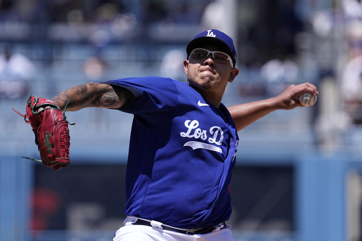 Starting pitcher Julio Urias #7 of the Los Angeles Dodgers warms up in the  bullpen prior to a baseball game between the Los Angeles Dodgers…