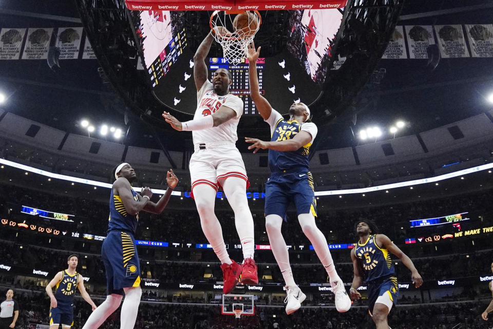 Chicago Bulls center Andre Drummond (3) dunks against Indiana Pacers center Myles Turner (33) during the first half of an NBA basketball game in Chicago, Wednesday, March 27, 2024. (AP Photo/Nam Y. Huh)