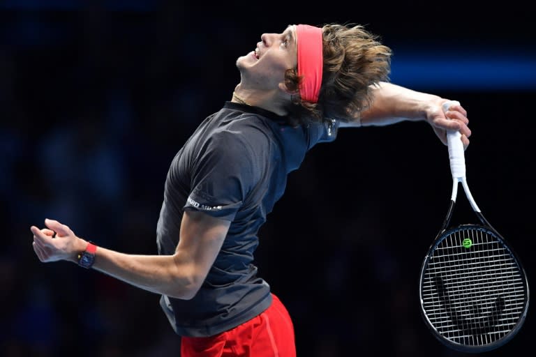 Alexander Zverev serves against Roger Federer in their last-four match at the ATP Finals in London