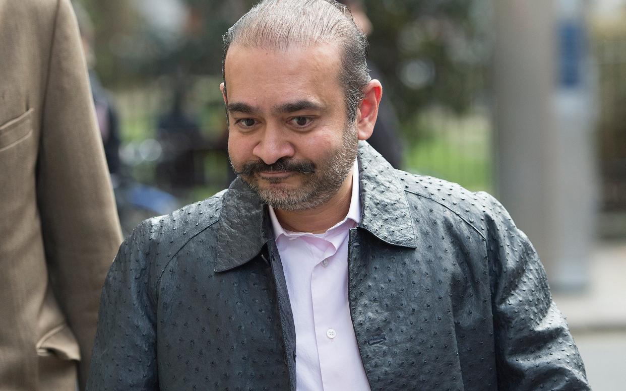 Mr Modi wearing a £10,000 ostrich hide jacket when confronted in the street by a Telegraph reporter in 2019 - Eddie Mulholland