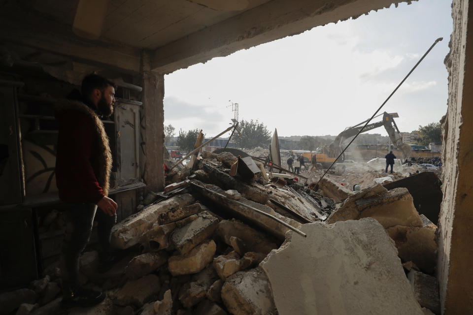 FILE - Rescue teams search through the wreckage of collapsed buildings after a devastating earthquake rocked Syria and Turkey, in Aleppo, Syria, Tuesday, Feb. 7, 2023. For years, the people of Aleppo bore the brunt of bombardment and fighting when their city, once Syria's largest and most cosmopolitan, was one of the civil war's fiercest battle zones. Even that didn't prepare them for the new devastation and terror wreaked by this week's earthquake. (AP Photo/Omar Sanadiki, File)