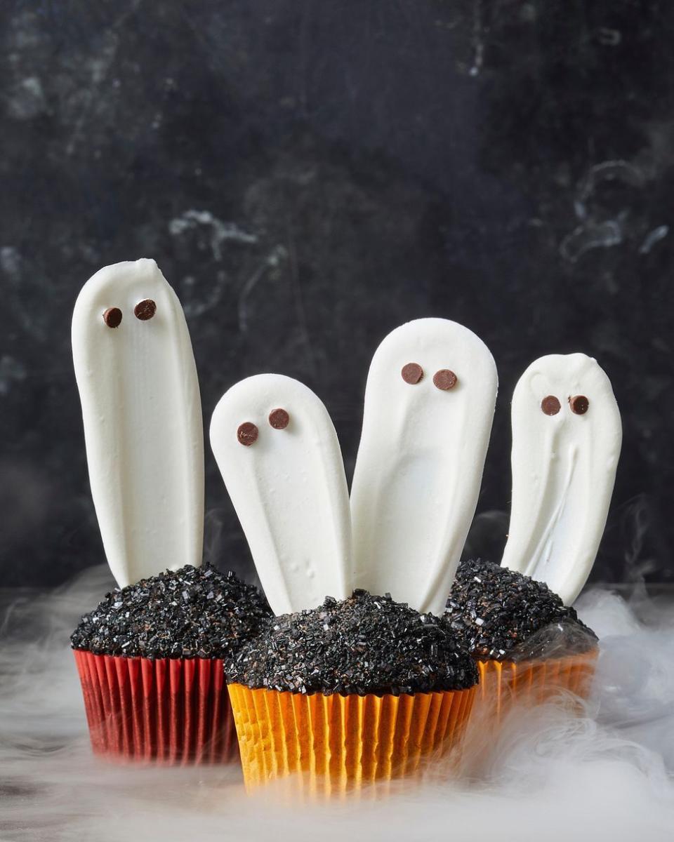 <p>Let these ghostly guys rise up from the ashes of a delicious chocolate cupcake.</p><p>Get the <a href="https://www.goodhousekeeping.com/food-recipes/party-ideas/a28591745/white-chocolate-ghost-cupcakes-recipe/" rel="nofollow noopener" target="_blank" data-ylk="slk:Ghost Cupcakes recipe;elm:context_link;itc:0;sec:content-canvas" class="link "><strong>Ghost Cupcakes recipe</strong></a><em>.</em></p>