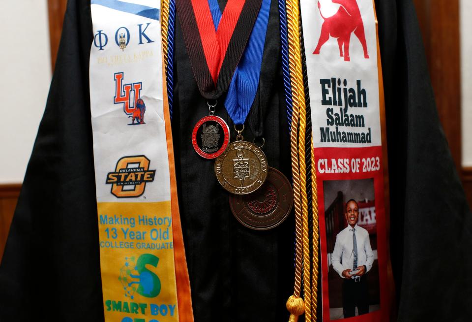 Elijah Muhammad, 13, poses for photo Wednesday at his home in Oklahoma City. The teenager has an associate degree from Oklahoma City Community College and three computer science mastery certificates from OCCC.