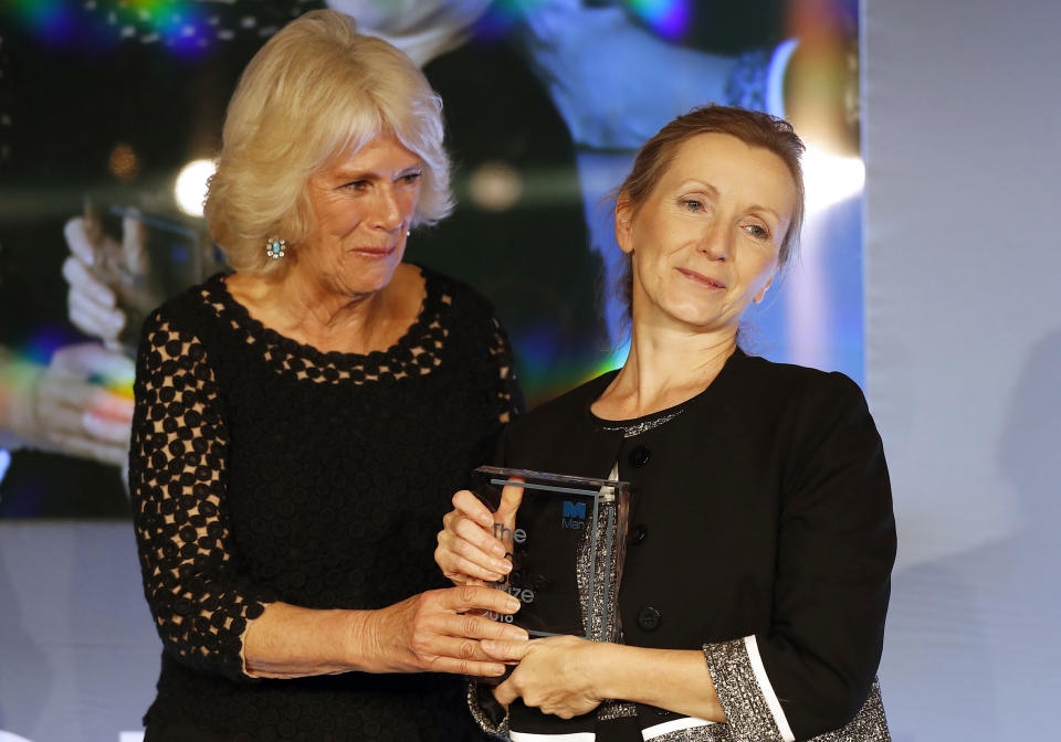 Britain's Camilla, the Duchess of Cornwall presents the Man Booker Prize for Fiction 2018 to British writer Anna Burns during the prize's 50th year at the Guildhall in London, Tuesday, Oct. 16, 2018.(AP Photo/Frank Augstein, Pool)