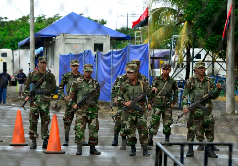 Nicaraguan soldiers at a checkpoint on the other side of the border in Penas Blancas, Costa Rica