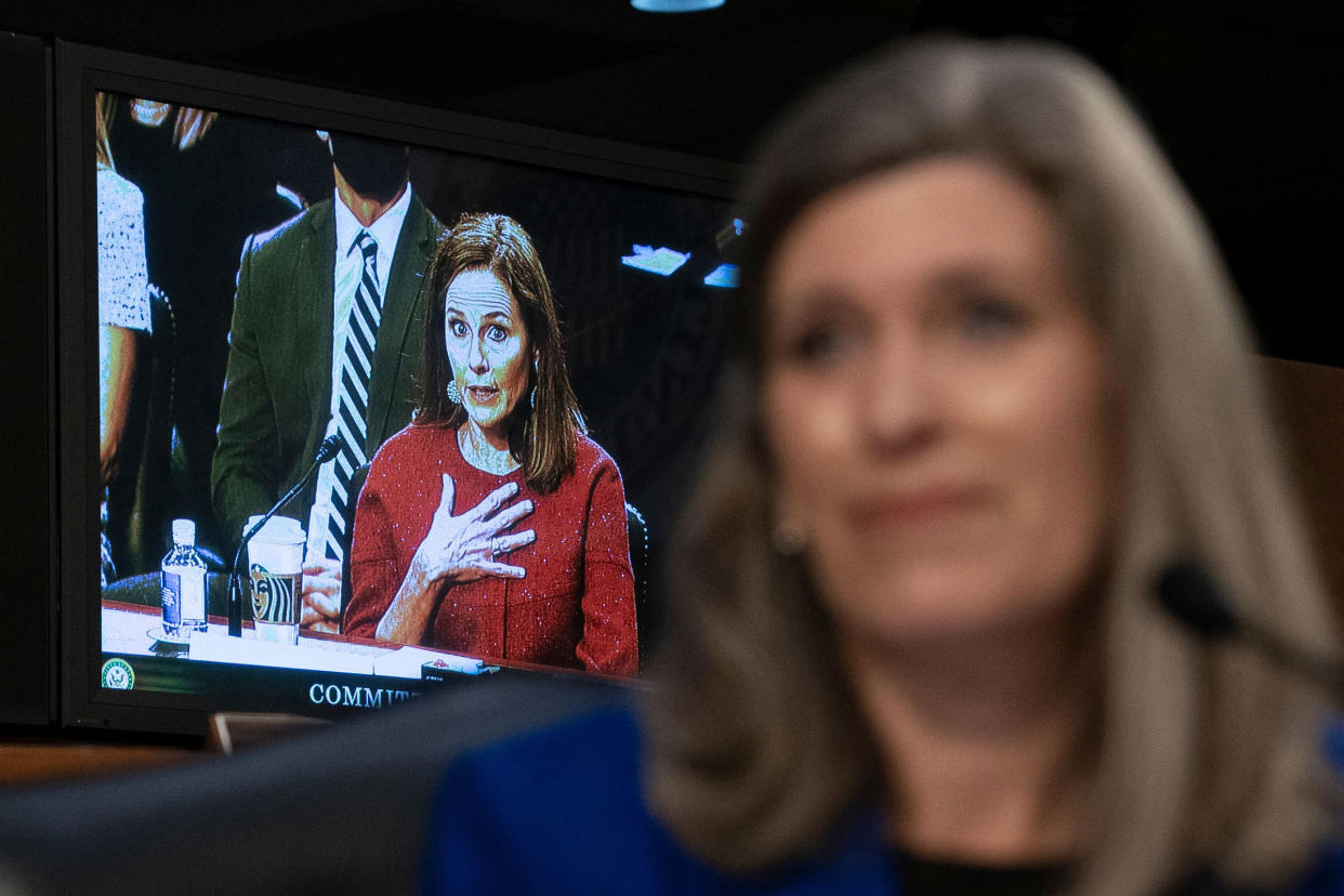 Supreme Court nominee Judge Amy Coney Barrett answers a question from Sen. Joni Ernst on the second day of her Supreme Court confirmation hearings before the Senate Judiciary Committee on Capitol Hill on Oct. 13, 2020.