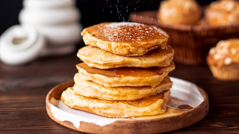 Pancake stack topped with powdered sugar