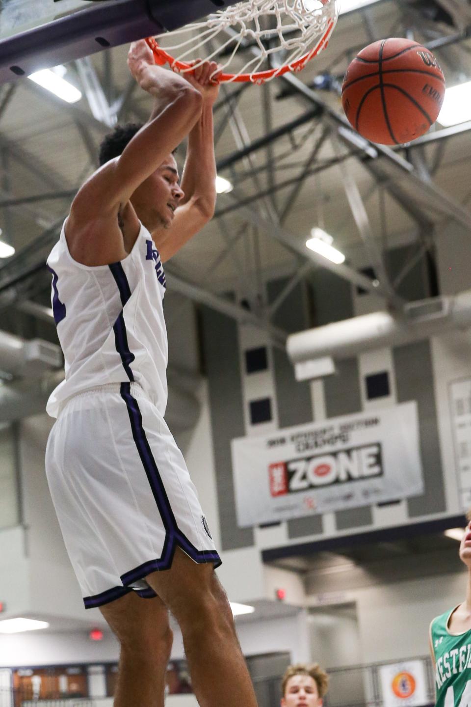 Brownsburg's Pierce Thomas (11) up for the dunk during the Brownsburg vs Westfield varsity IHSAA boys basketball game held at Brownsburg High School, January 24, 2020.