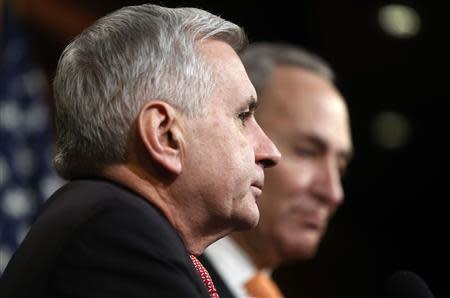 U.S. Senator Jack Reed (D-RI) (L) and Senator Chuck Schumer (D-NY) speak to reporters about their reaction to the failure of the Senate to vote to extend unemployment insurance benefits, at the U.S. Capitol in Washington, January 14, 2014. REUTERS/Jonathan Ernst