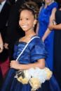 <i>Una cartera de cachorrito.</i> Con sólo 9 años, la actriz <i>Quvenzhané Wallis</i> arribó a la alfombra roja junto a su madre. Allí contó que eligió su vestido azul por sus brillos y volados. Y, cuando se le preguntó por su cartera en forma de perrito, explicó que simplemente le hacía acordar a su propia mascota. Tierna y también con mucha (y temprana) personalidad.