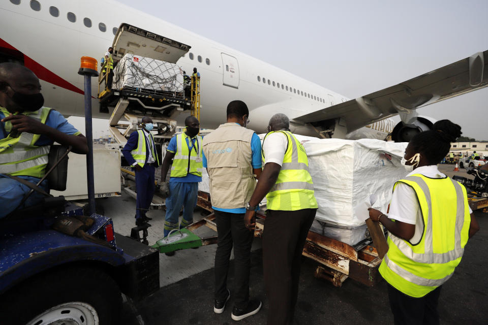 This photograph released by UNICEF Wednesday Feb. 24, 2021 shows the first shipment of COVID-19 vaccines distributed by the COVAX Facility arriving at the Kotoka International Airport in Accra, Ghana. As the coronavirus pandemic exploded worldwide last April, global organizations banded together to help ensure vaccines would be distributed fairly. But the COVAX initiative has been dogged by shortages of cash and supplies as well as logistical hurdles, and only on Wednesday did the first vaccines bought by program arrive in Ghana. (Francis Kokoroko/UNICEF via AP)