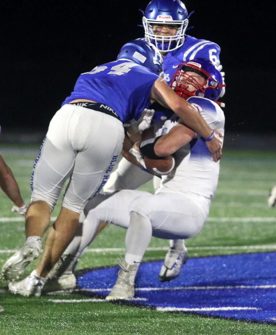 Horseheads' Marshall Winkky tackles Owego's Steven Bidwell during the Blue Raiders' 35-12 win in their homecoming game Sept. 30, 2022 at Horseheads High School.