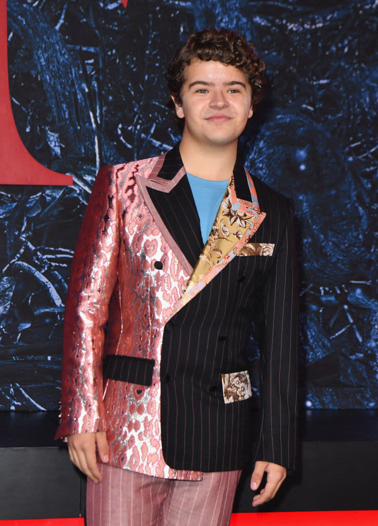 Gaten in a half pinstripe half shiny print blazer and suit